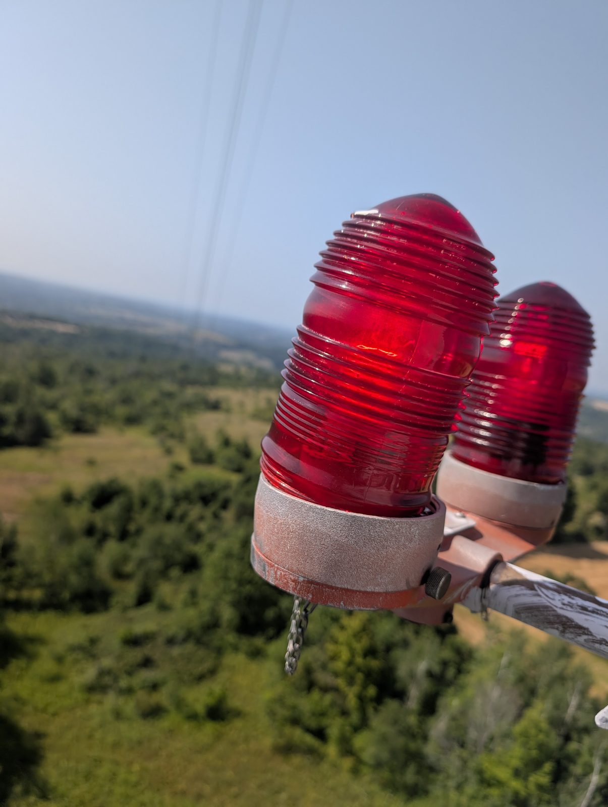 Red aviation obstruction beacons on a tower