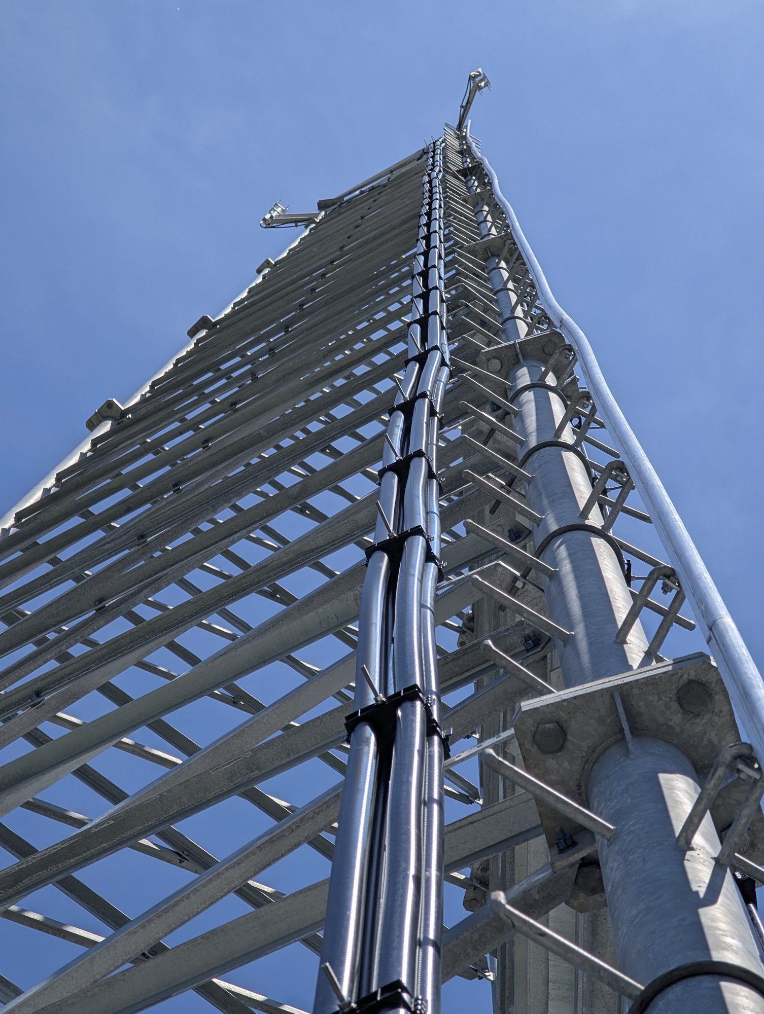 Climbing a galvanized self-support lattice tower