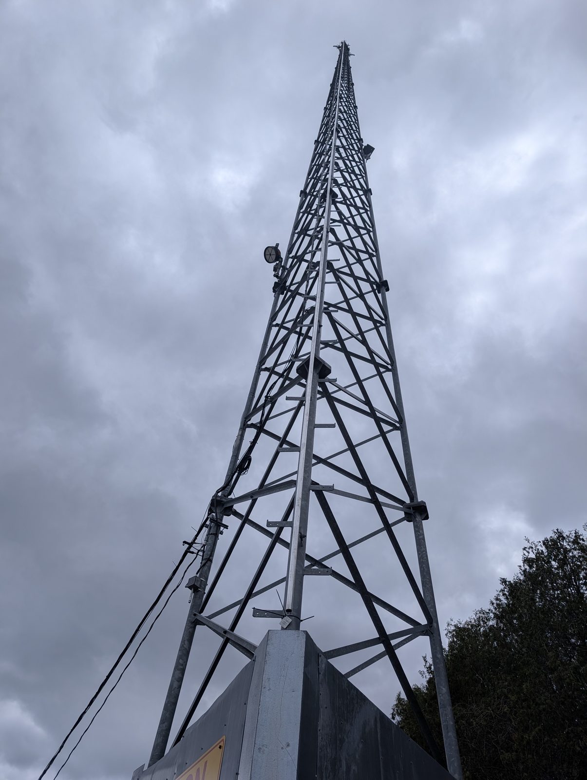Galvanized lattice tower from the base looking up